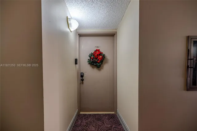 a view of gallery with wooden floor