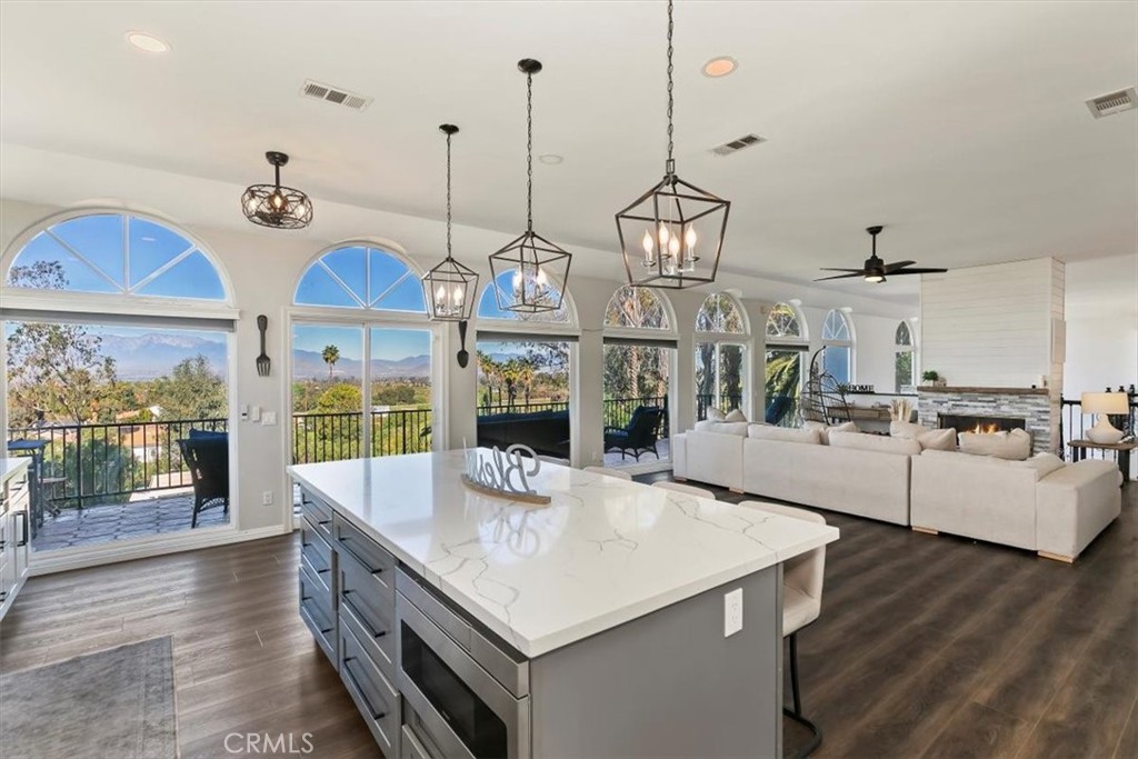 1619 Gratton Street Riverside, CA 92504 - Photo 18 of 62 a kitchen with stainless steel appliances granite countertop a sink a stove and a wooden floors