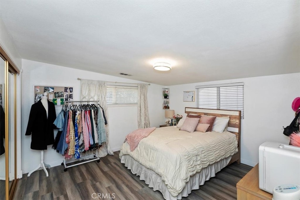 1619 Gratton Street Riverside, CA 92504 - Photo 33 of 62 a bedroom with a bed and a walk in closet