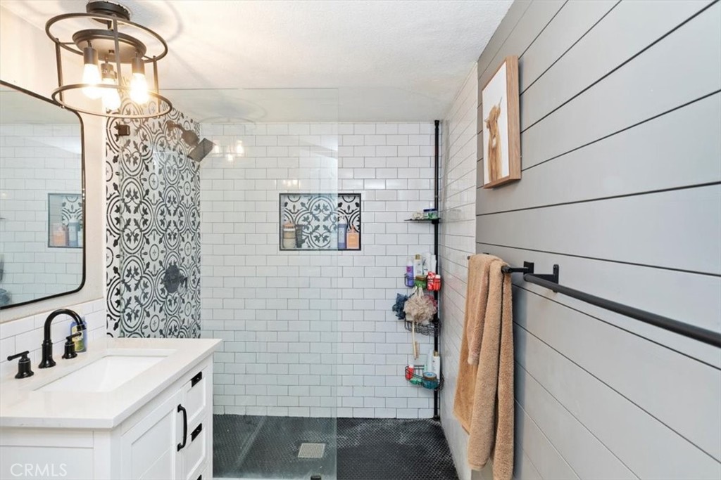 1619 Gratton Street Riverside, CA 92504 - Photo 37 of 62 a bathroom with a sink a toilet and shower