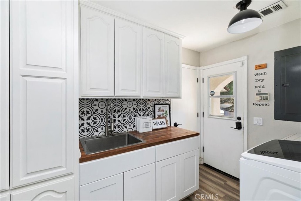 1619 Gratton Street Riverside, CA 92504 - Photo 38 of 62 a kitchen with a sink and cabinets