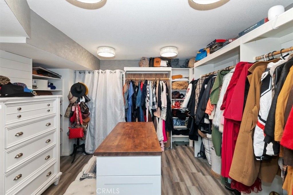 1619 Gratton Street Riverside, CA 92504 - Photo 41 of 62 a view of walk in closet with clothes and shoes