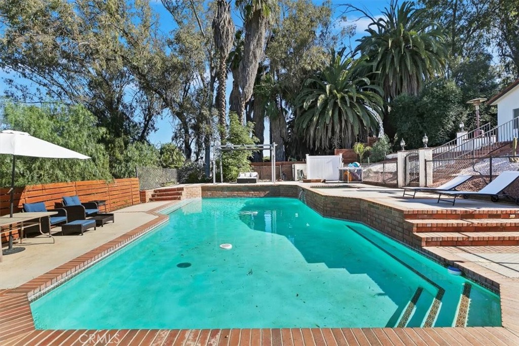 1619 Gratton Street Riverside, CA 92504 - Photo 52 of 62 a view of backyard with swimming pool and furniture