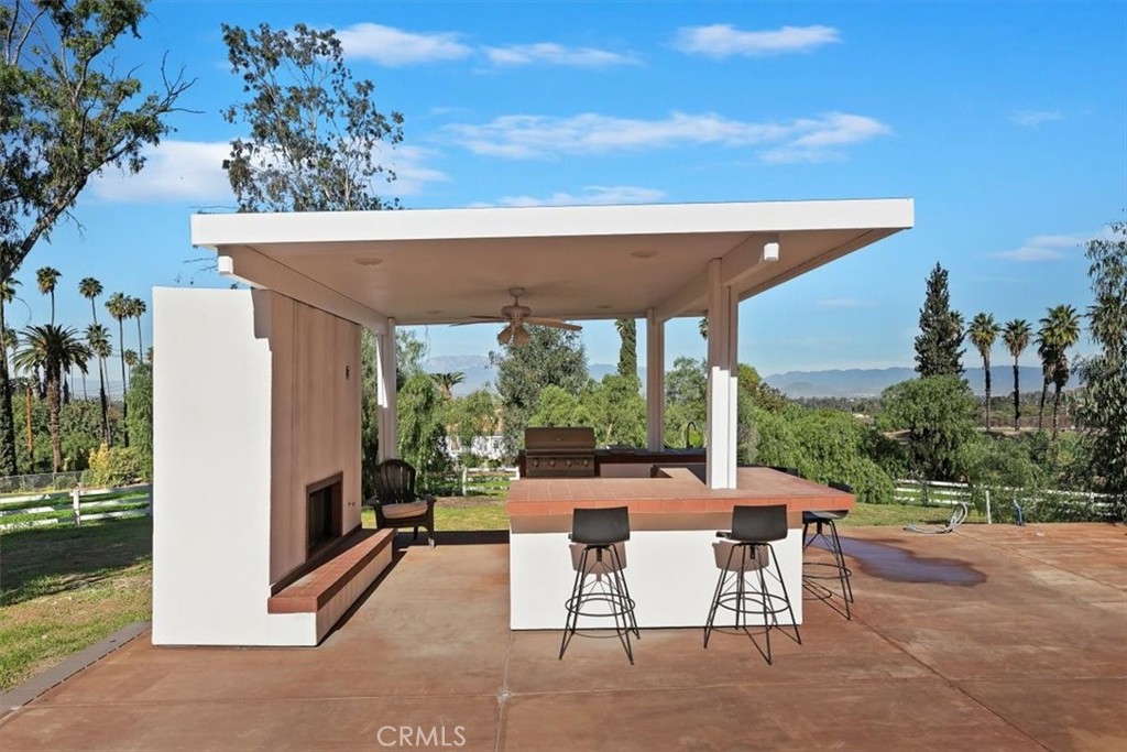 1619 Gratton Street Riverside, CA 92504 - Photo 56 of 62 a view of a patio with couches table and chairs and potted plants