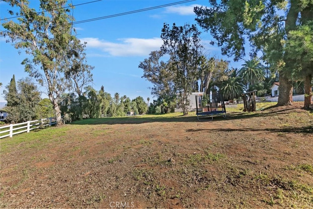 1619 Gratton Street Riverside, CA 92504 - Photo 59 of 62 a view of dirt field with trees in the background