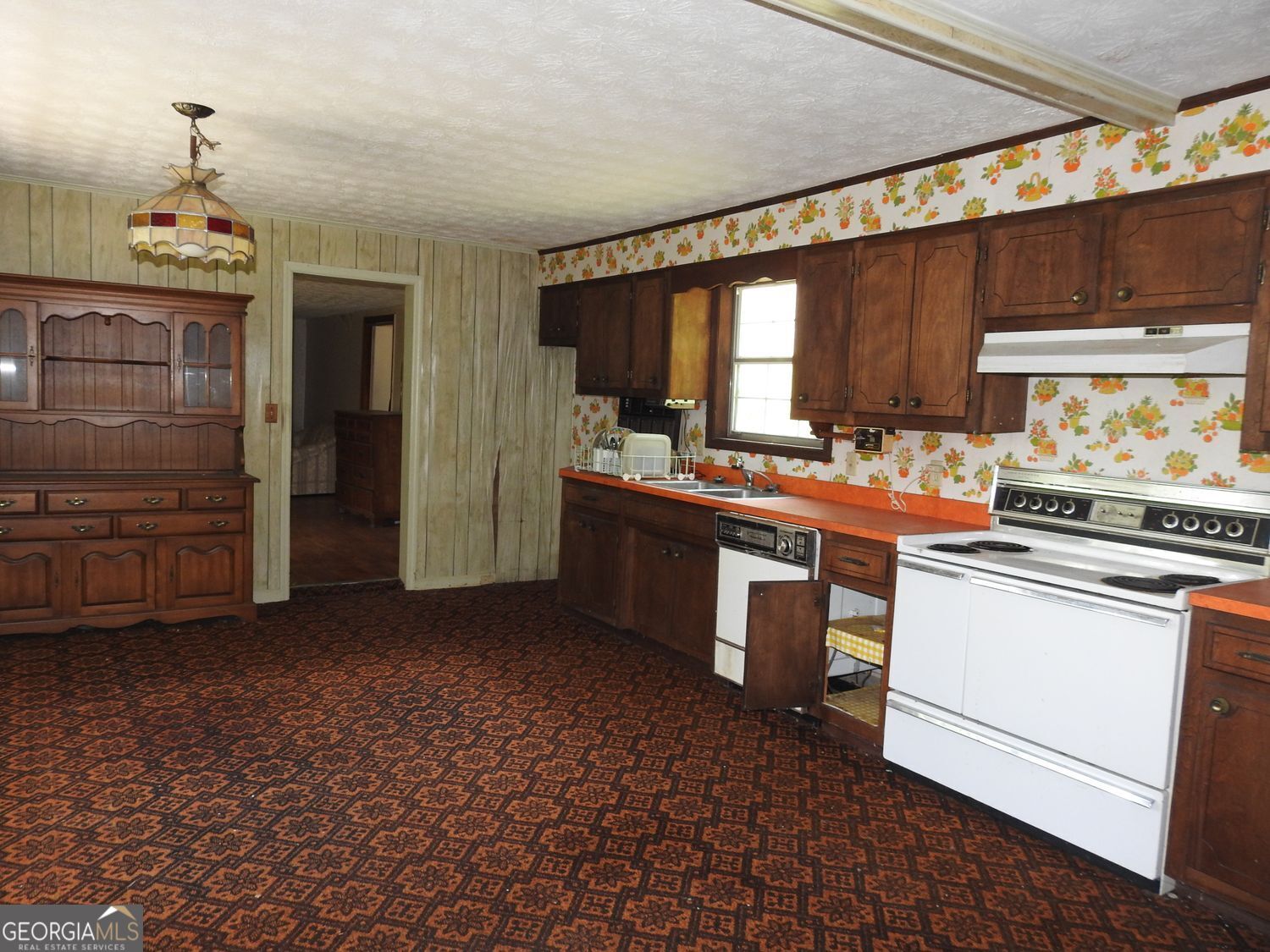 333 Lickskillet Road Epworth, GA 30541 - Photo 12 of 38 a kitchen with a stove and a refrigerator