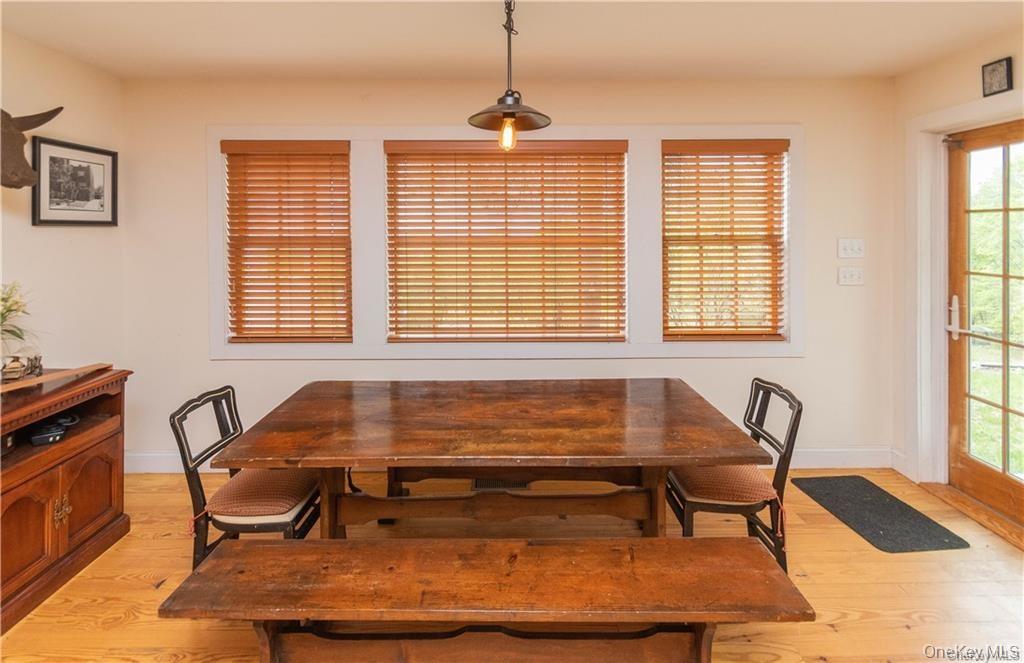 669 Mountain Road Bloomingburg, NY 12721 - Photo 10 of 36 Dining room with light wood-style flooring and baseboards