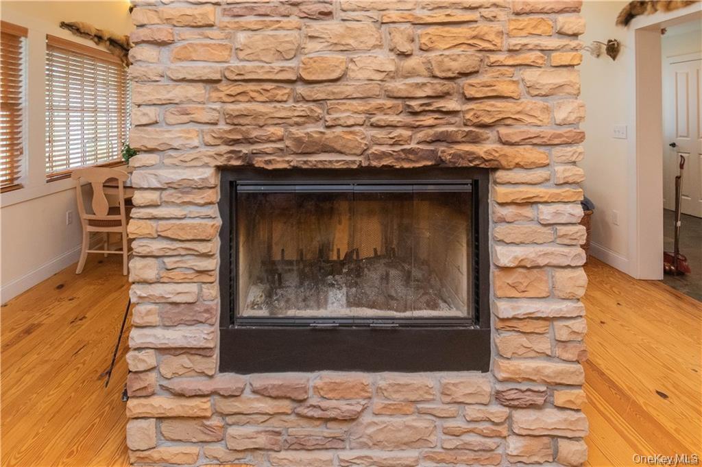 669 Mountain Road Bloomingburg, NY 12721 - Photo 11 of 36 Detailed view of a fireplace and wood finished floors