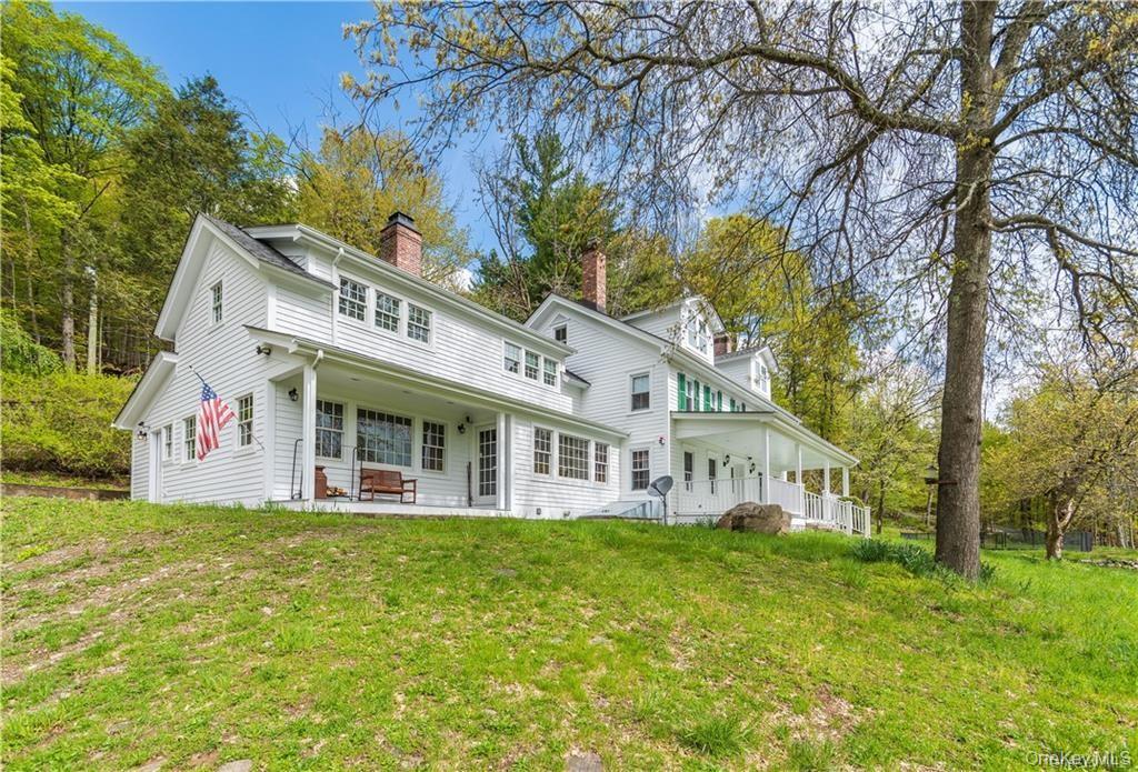 669 Mountain Road Bloomingburg, NY 12721 - Photo 2 of 36 featuring a chimney, a yard, a patio area, and view of scattered trees