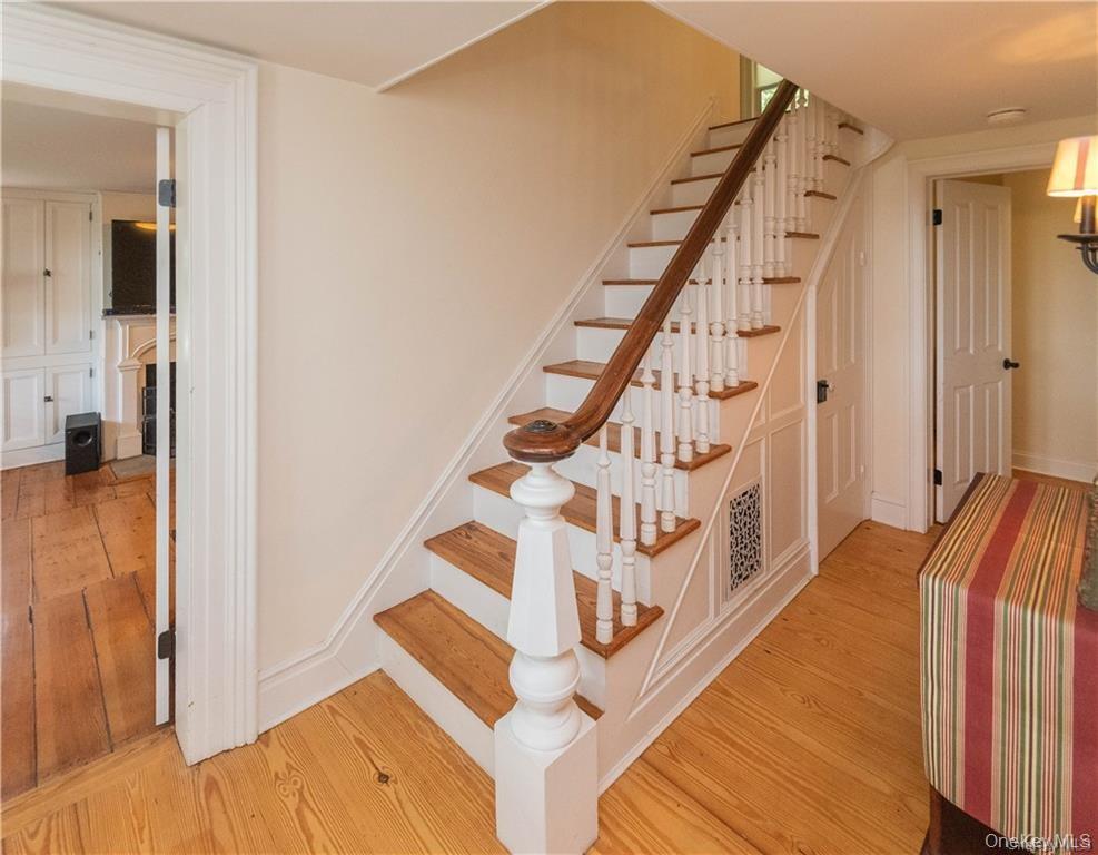 669 Mountain Road Bloomingburg, NY 12721 - Photo 21 of 36 Staircase featuring wood finished floors