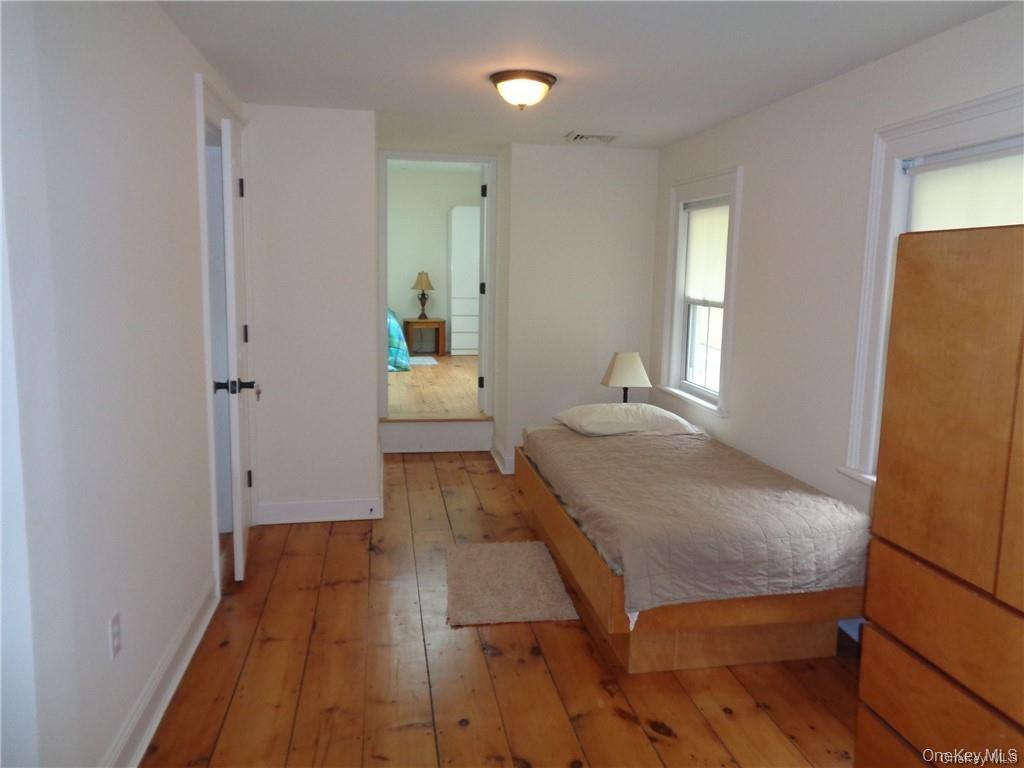 669 Mountain Road Bloomingburg, NY 12721 - Photo 30 of 36 Bedroom featuring light wood finished floors and baseboards
