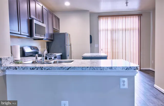a room with wooden floor and furniture