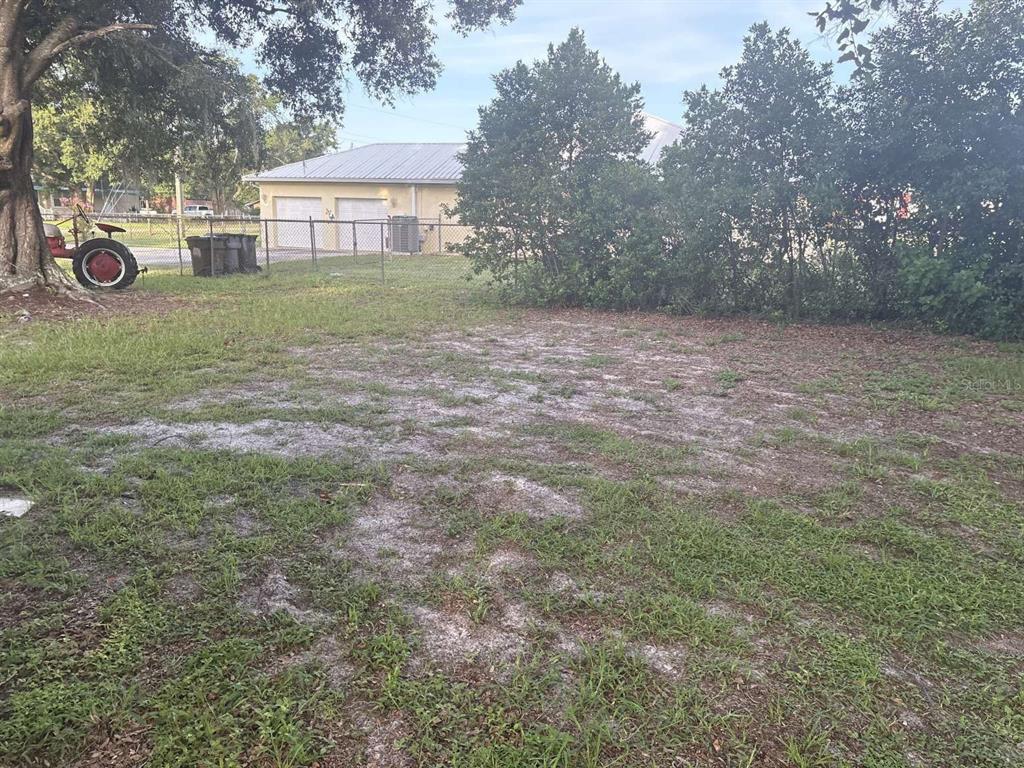 1511 Gaines Road Winter Haven, FL 33880 - Photo 15 of 20 a view of a backyard with large trees