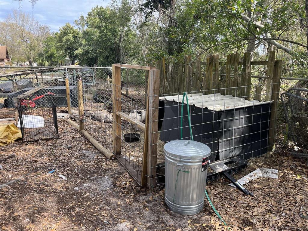 1511 Gaines Road Winter Haven, FL 33880 - Photo 17 of 20 a view of a chair and table in the backyard