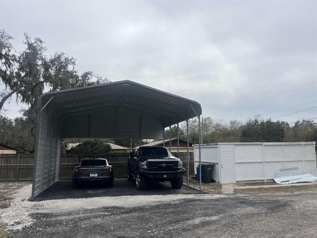 1511 Gaines Road Winter Haven, FL 33880 - Photo 19 of 20 a car parked in front of a house