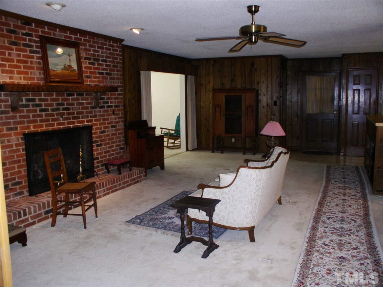 96 Pine View Road Henderson, NC 27537 - Photo 2 of 25 Large family room with fireplace and gas logs.