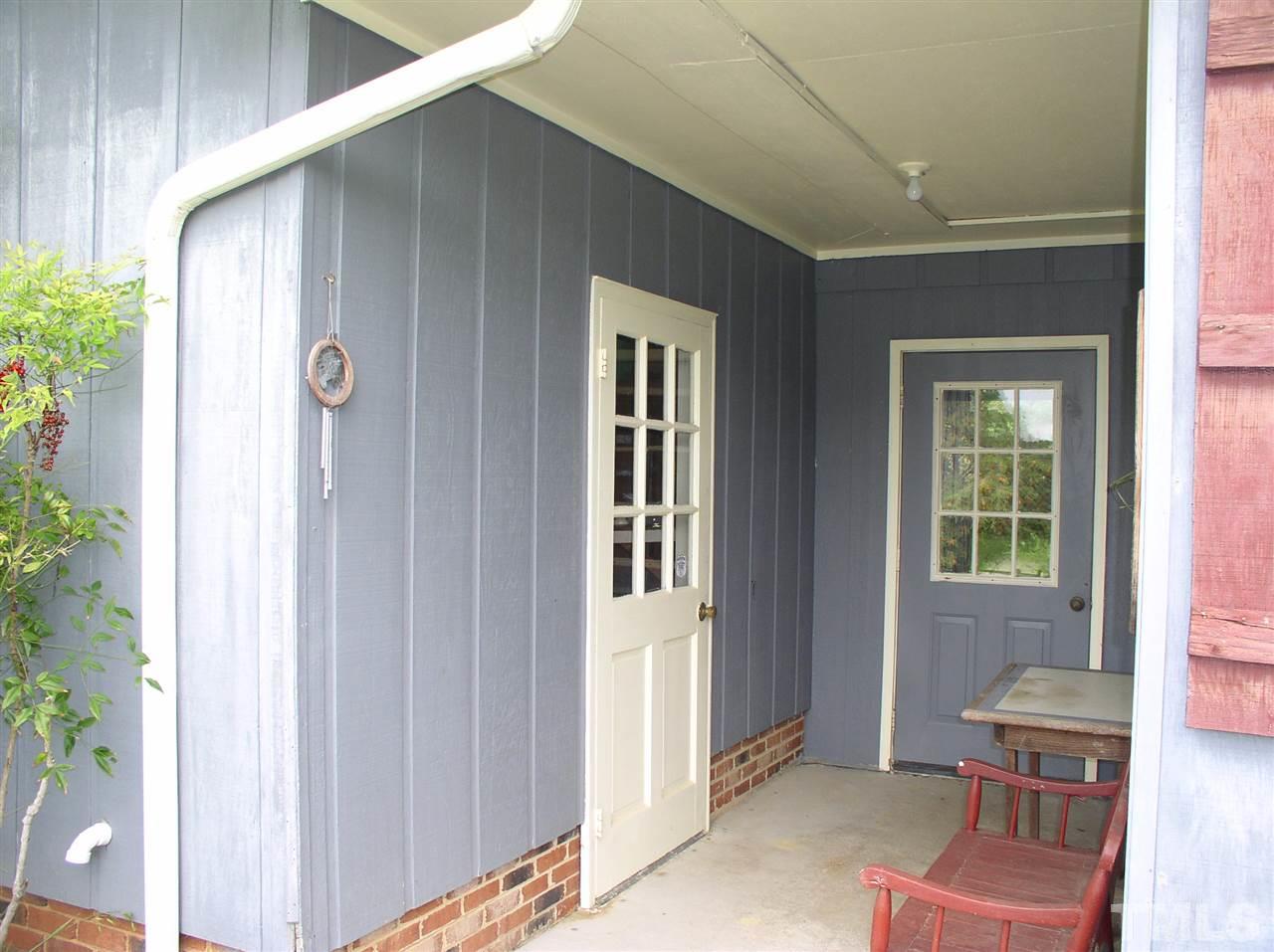 96 Pine View Road Henderson, NC 27537 - Photo 22 of 25 Breezeway off carport with workshop area.
