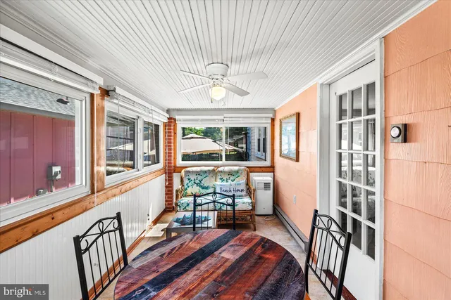 a bedroom with a large bed and a desk