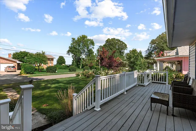 a view of a balcony with wooden floor