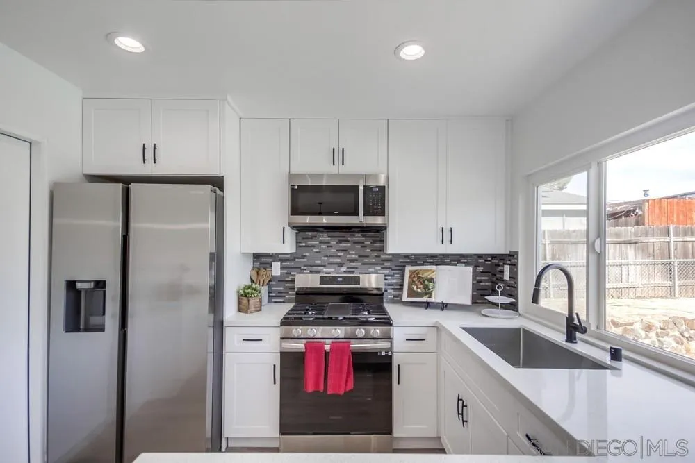 10021 Allenwood Way Santee, CA 92071 - Photo 11 of 30 a kitchen with stainless steel appliances granite countertop a refrigerator sink and stove