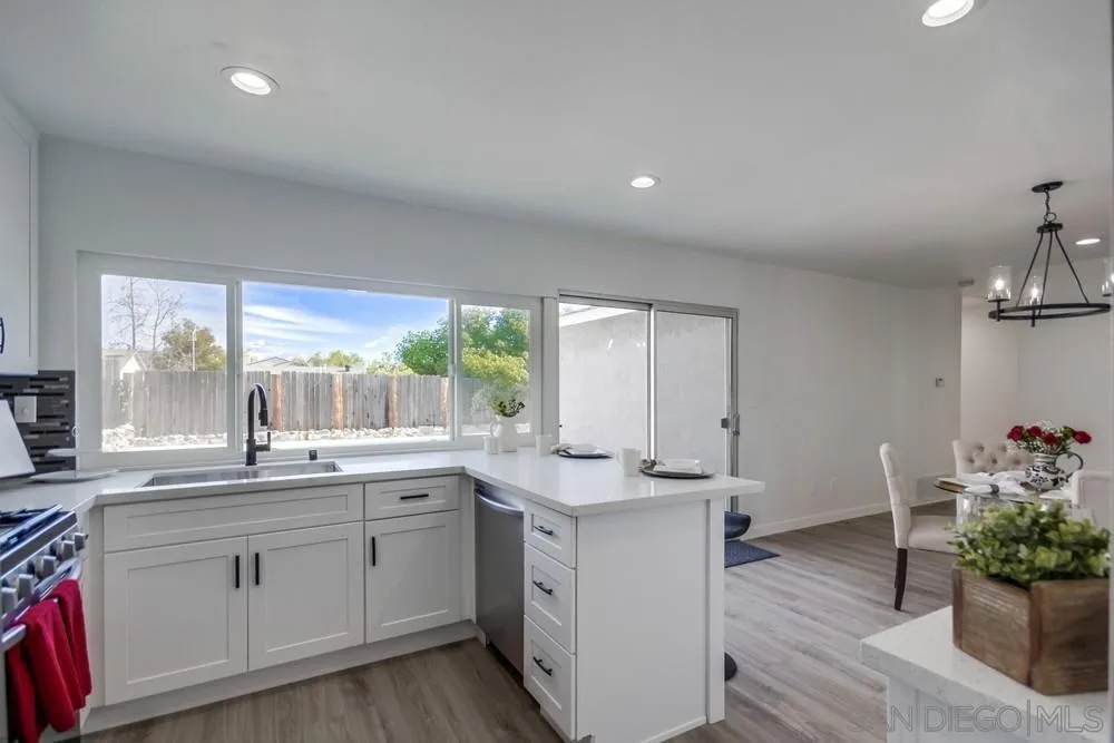 10021 Allenwood Way Santee, CA 92071 - Photo 14 of 30 a kitchen with a sink stove and cabinets