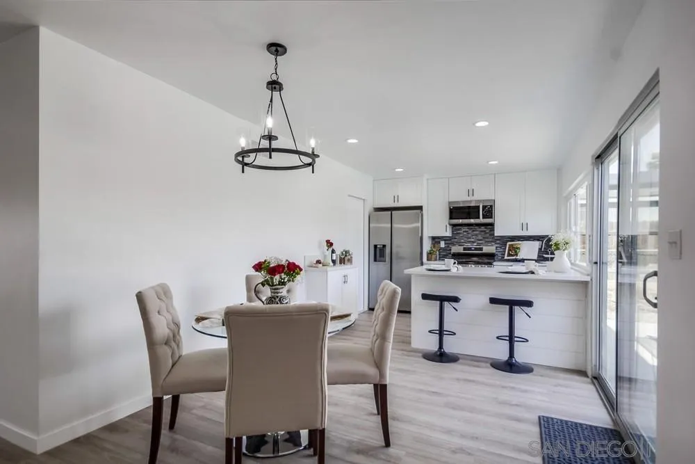 10021 Allenwood Way Santee, CA 92071 - Photo 17 of 30 a view of a dining room with furniture wooden floor and a chandelier