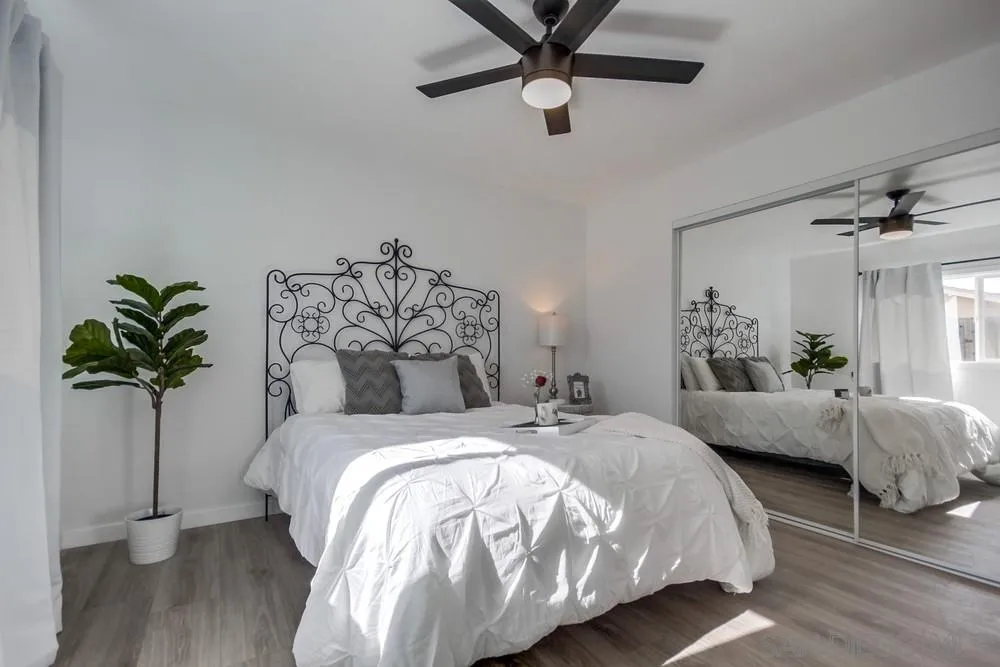 10021 Allenwood Way Santee, CA 92071 - Photo 19 of 30 a bed sitting in a bedroom and chandelier