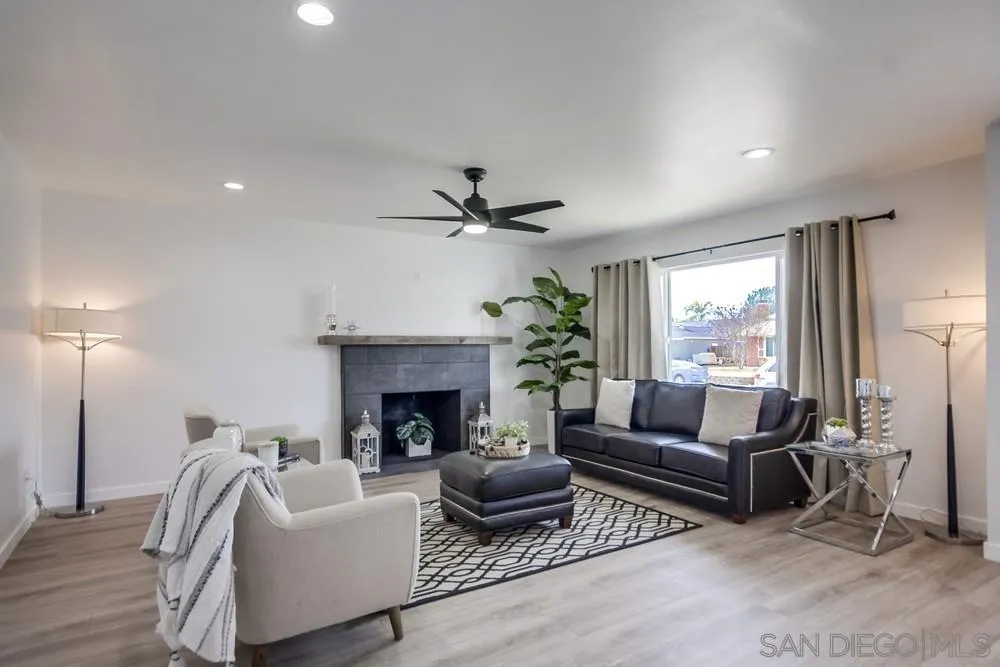 10021 Allenwood Way Santee, CA 92071 - Photo 4 of 30 a living room with furniture and a fireplace