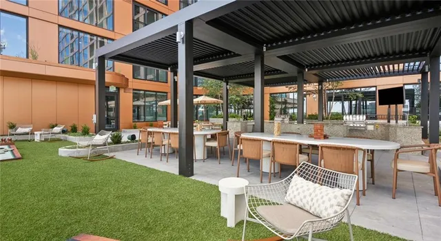 a view of a livingroom with furniture and staircase
