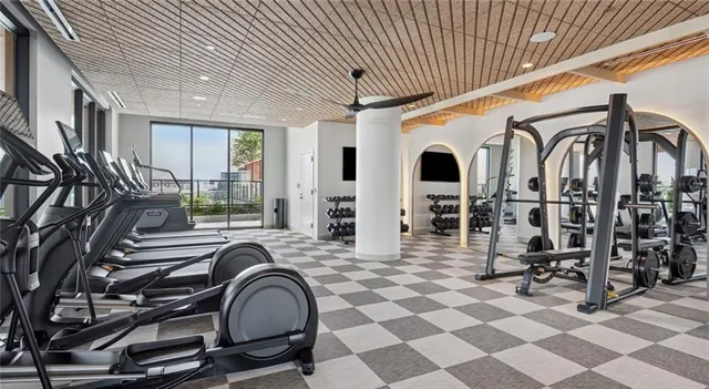 a media room with lots of chairs and a projector