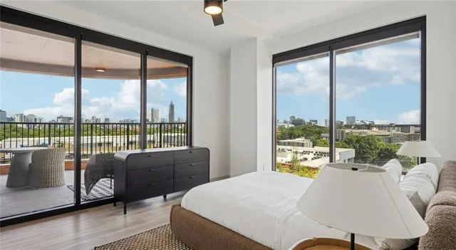 a bed room with a bed and a large window