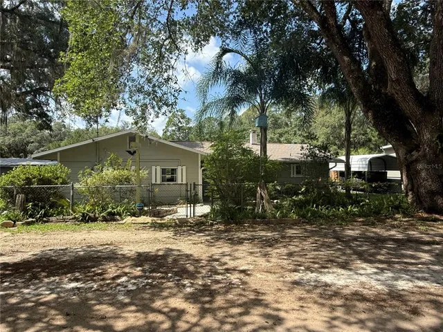 a view of house with yard
