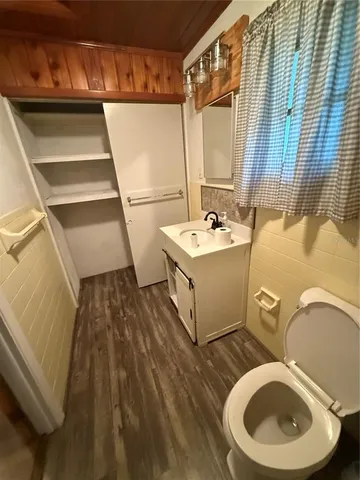 a bedroom with a bed and a walk in closet