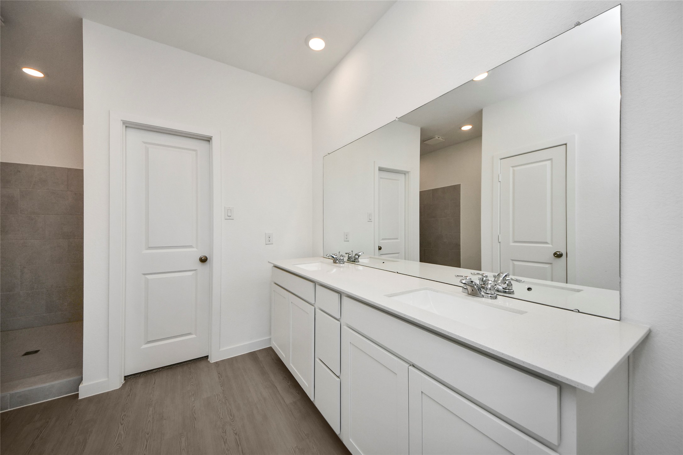 26418 Virginia Wild Rye Lane Katy, TX 77493 - Photo 11 of 26 a bathroom with a sink and a mirror
