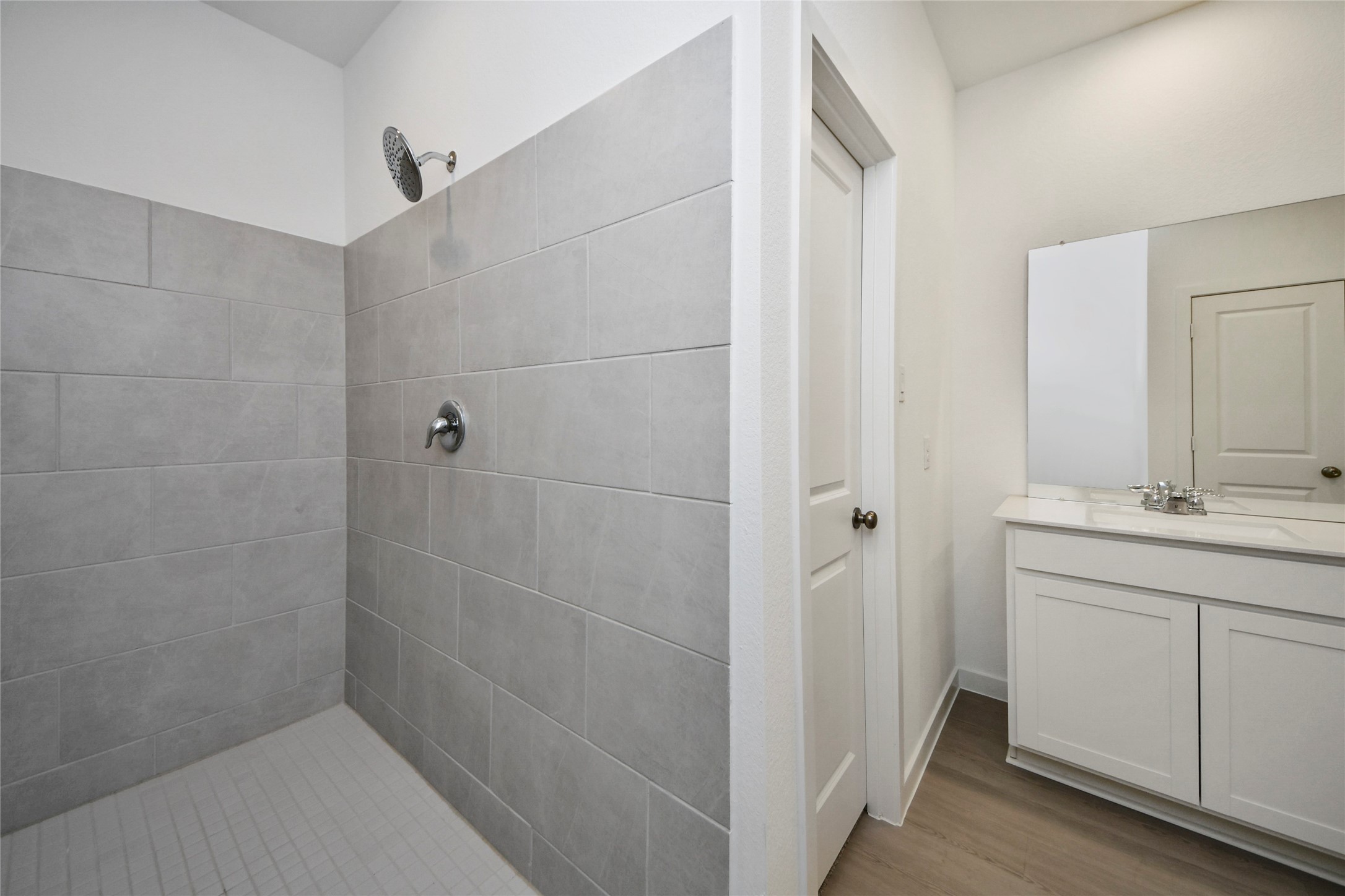 26418 Virginia Wild Rye Lane Katy, TX 77493 - Photo 12 of 26 a bathroom with a shower and a sink