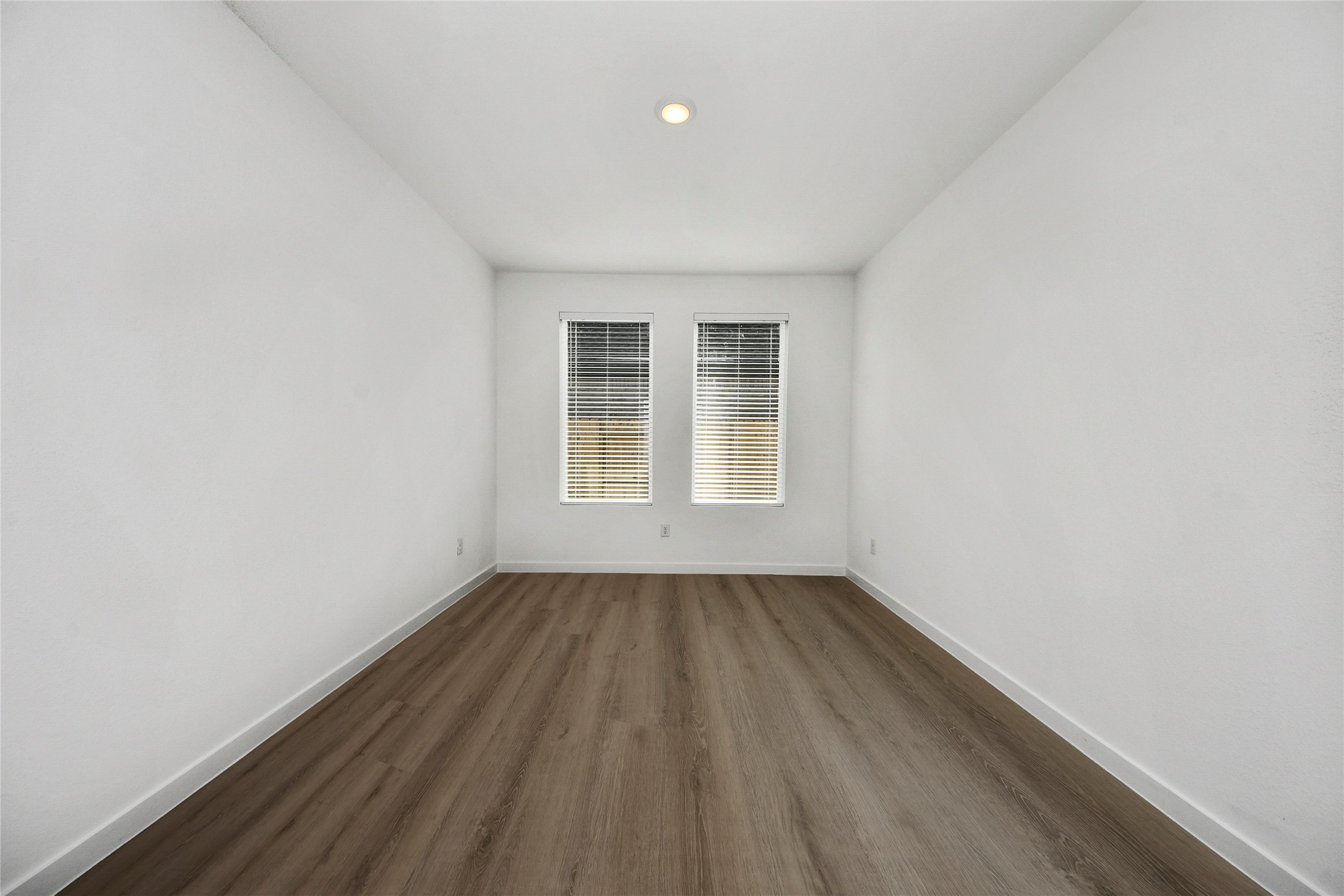 26418 Virginia Wild Rye Lane Katy, TX 77493 - Photo 18 of 26 an empty room with wooden floor and windows
