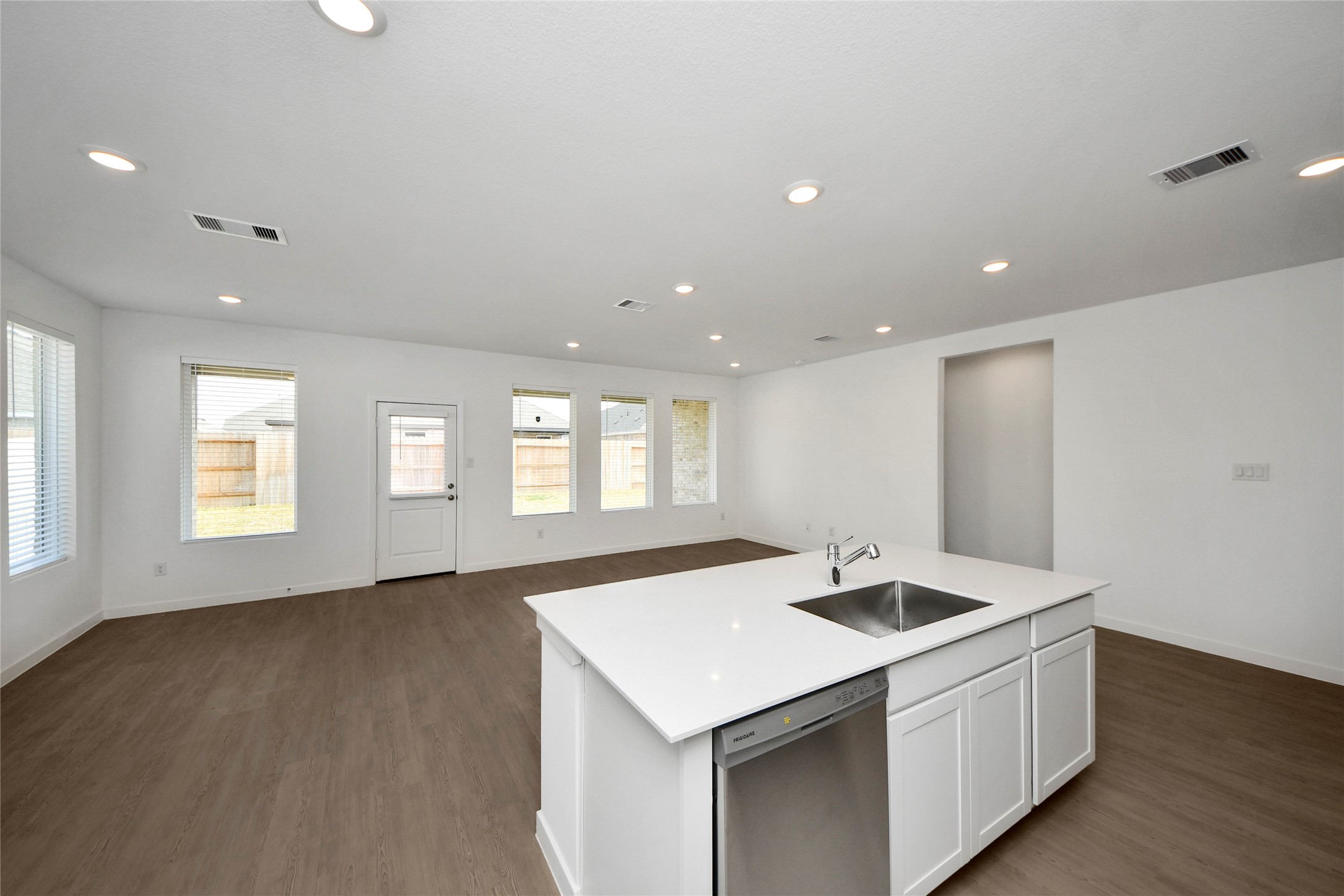 26418 Virginia Wild Rye Lane Katy, TX 77493 - Photo 6 of 26 a kitchen with stainless steel appliances granite countertop a sink a window and wooden floor