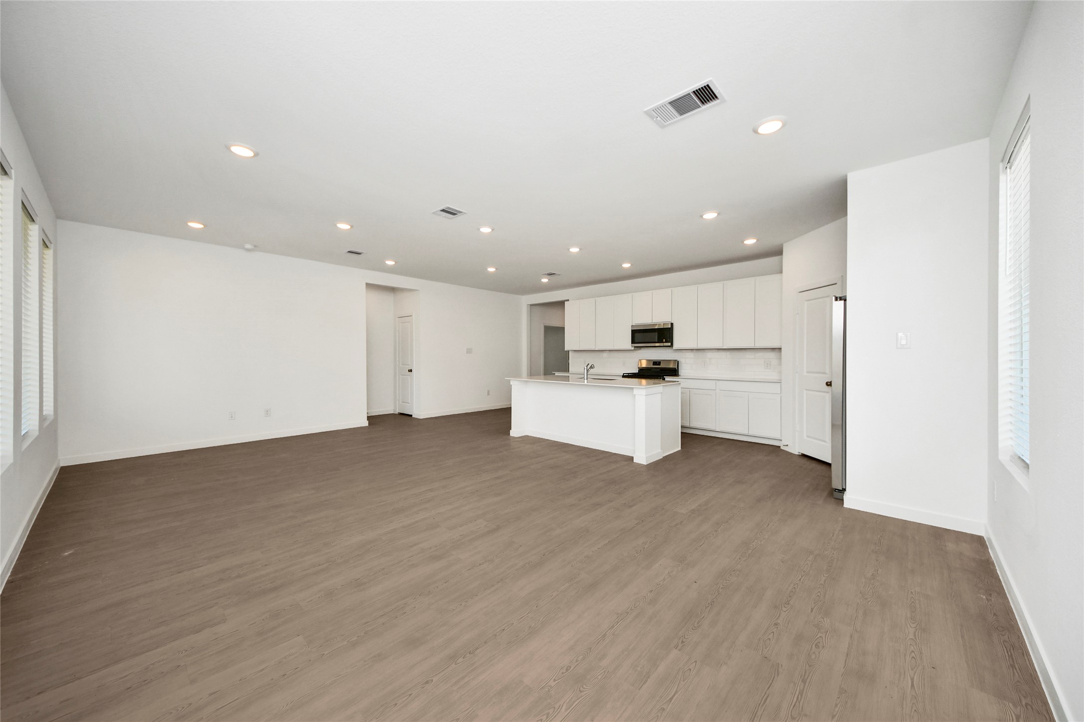 26418 Virginia Wild Rye Lane Katy, TX 77493 - Photo 8 of 26 a view of a kitchen with sink stainless steel appliances and cabinets