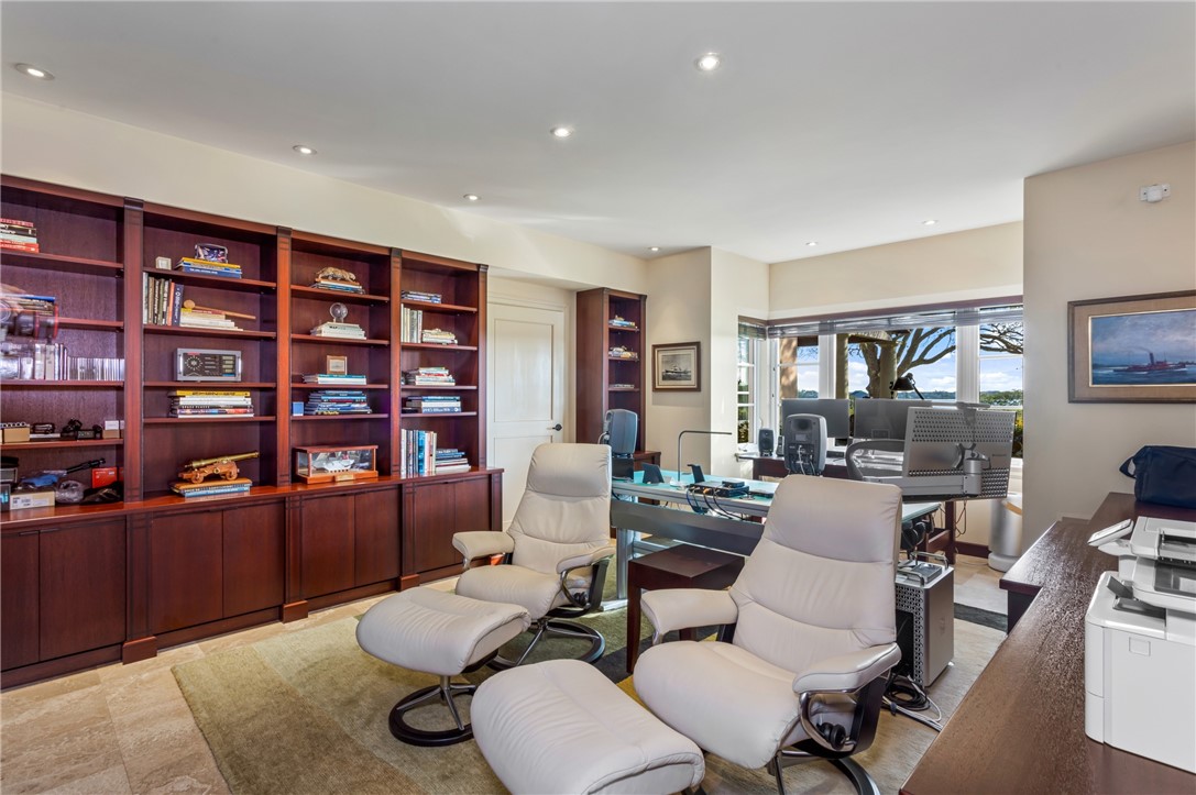 2350 Quay Dock Road Vero Beach, FL 32967 - Photo 18 of 33 a living room with furniture and a bookshelf