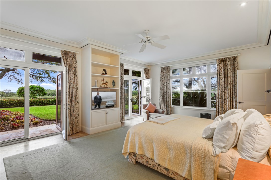 2350 Quay Dock Road Vero Beach, FL 32967 - Photo 21 of 33 a large bedroom with a bed and glass door