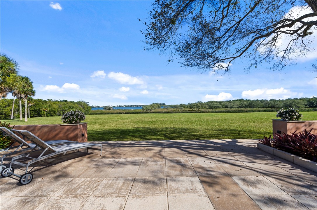 2350 Quay Dock Road Vero Beach, FL 32967 - Photo 27 of 33 a view of a swimming pool and lounge chairs in the patio