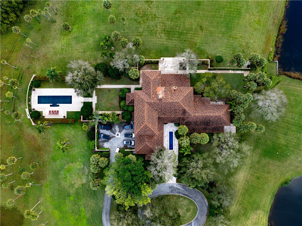 2350 Quay Dock Road Vero Beach, FL 32967 - Photo 32 of 33 an aerial view of a house with garden space and street view