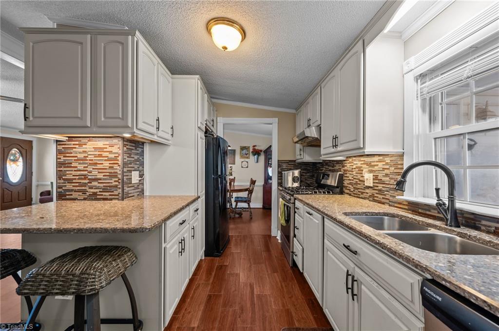 2348 John Thompson Road Graham, NC 27253 - Photo 12 of 34 Nice size island perfect for bar stools