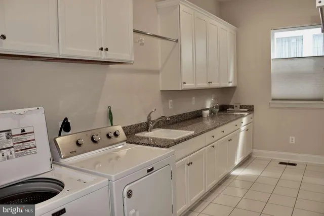 a room with a bed and a large window