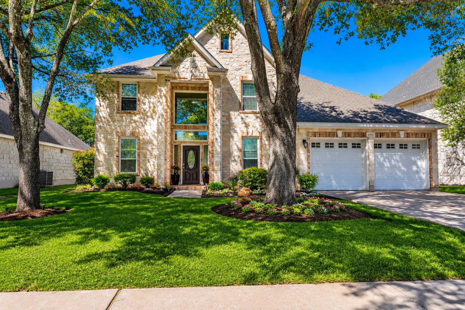 Virtually Enhanced Curb Appeal — This image has been digitally enhanced to demonstrate the property’s landscaping potential, featuring refreshed lawn appearance, enhanced flower beds, and seasonal color accents while preserving the home’s original architecture and exterior features. Improvements shown are for illustrative purposes only.