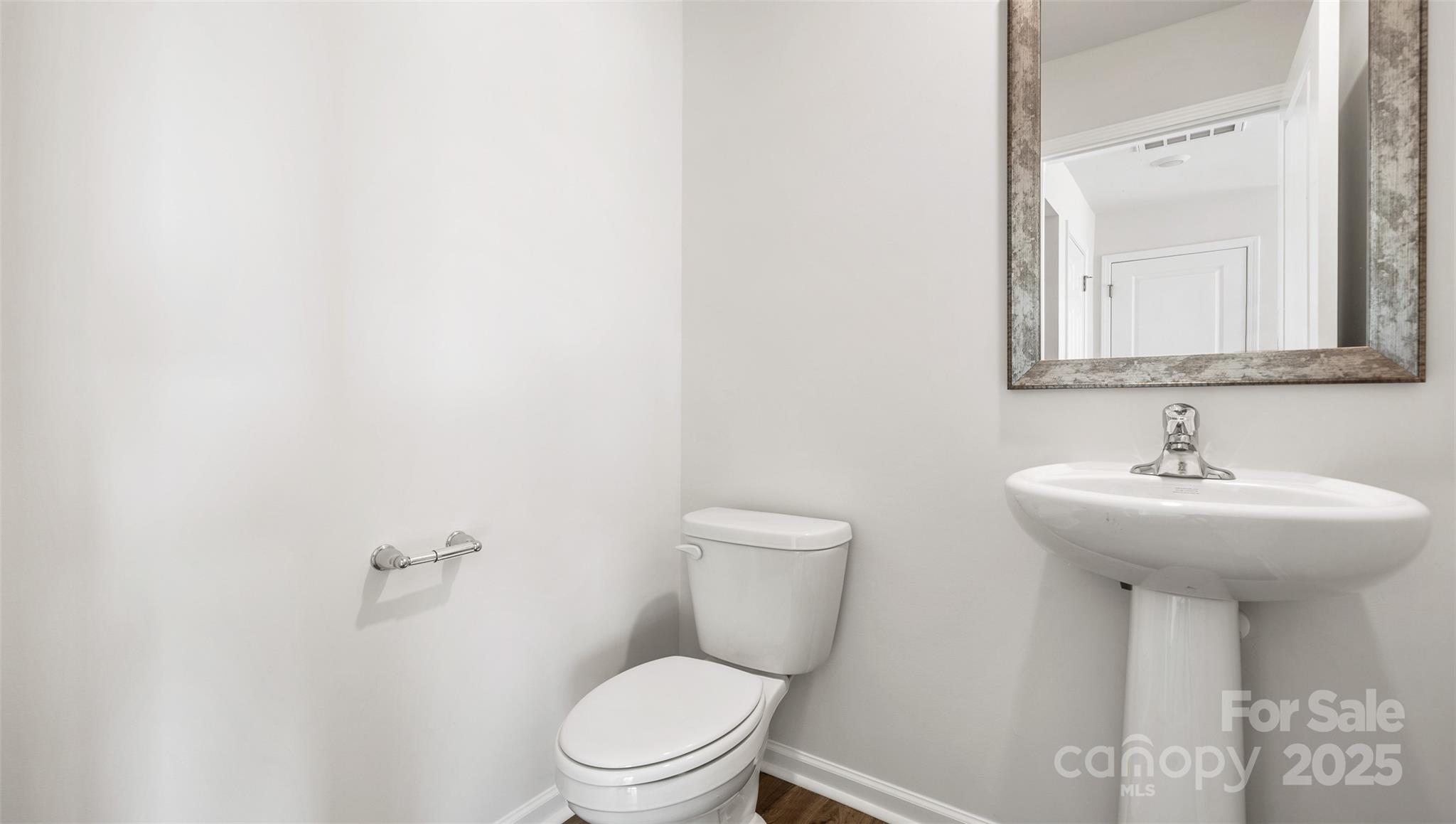 12 Byron Park Road Clyde, NC 28721 - Photo 15 of 20 a bathroom with a toilet sink and mirror