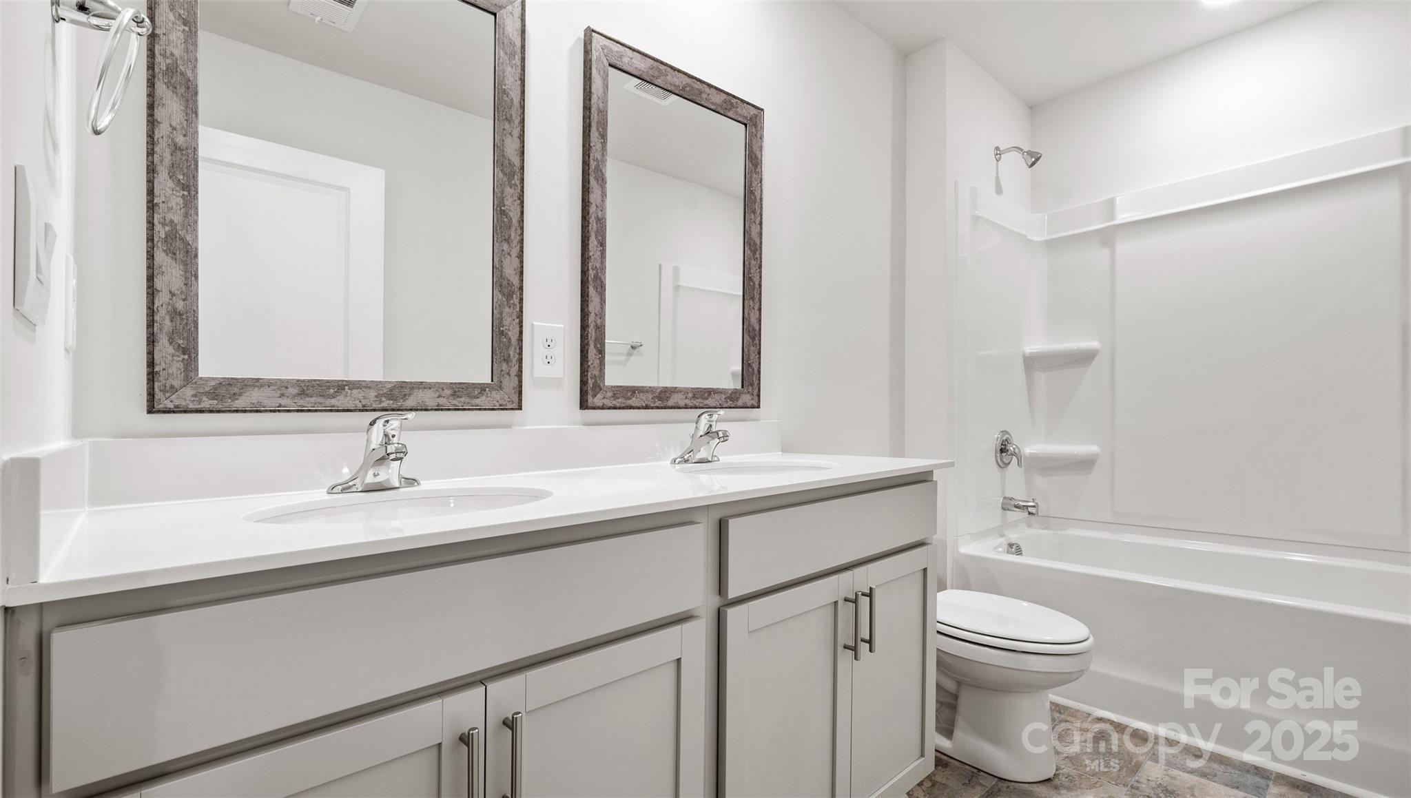 12 Byron Park Road Clyde, NC 28721 - Photo 17 of 20 a bathroom with a granite countertop toilet sink and a mirror