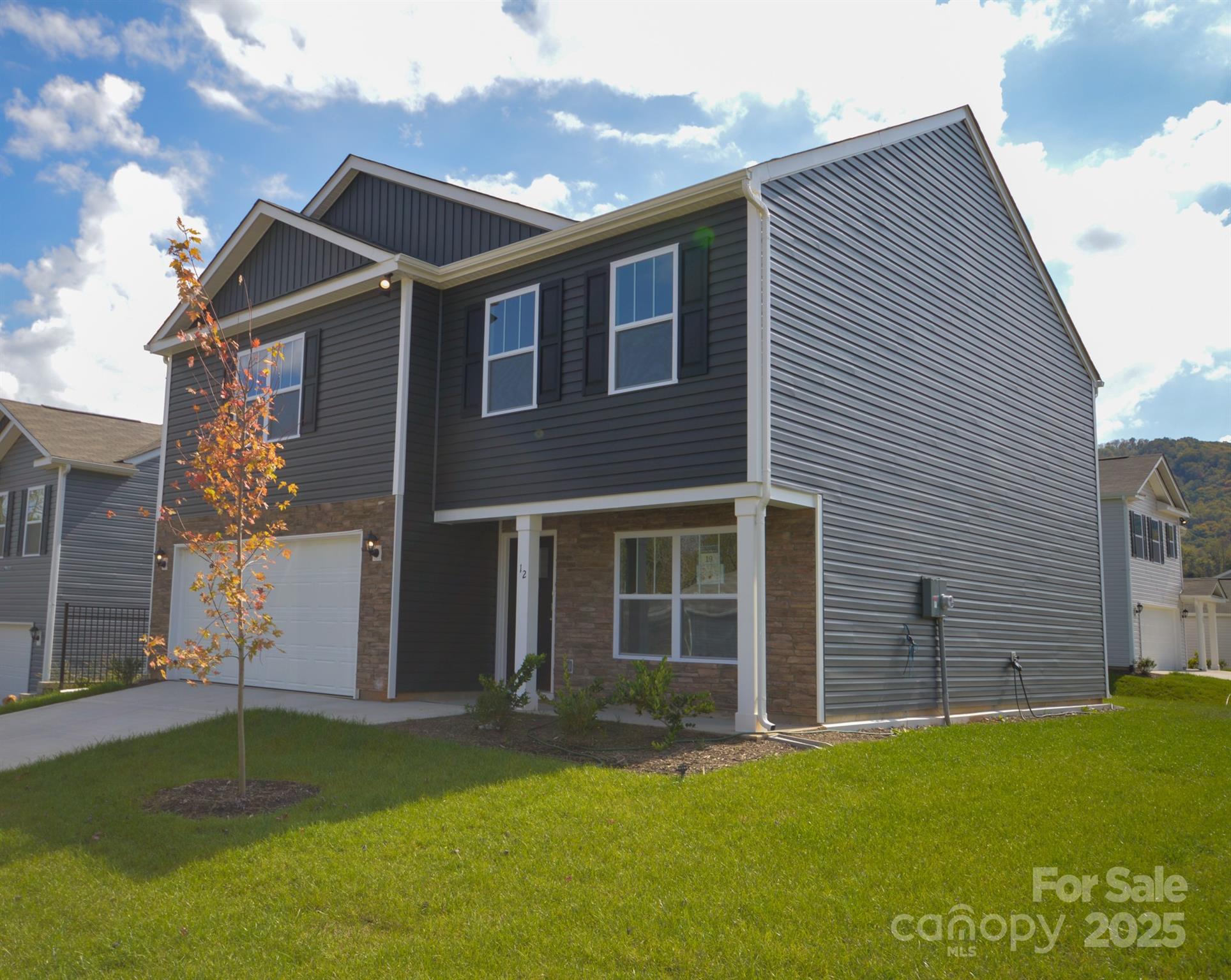 12 Byron Park Road Clyde, NC 28721 - Photo 3 of 20 a front view of a house with a garden