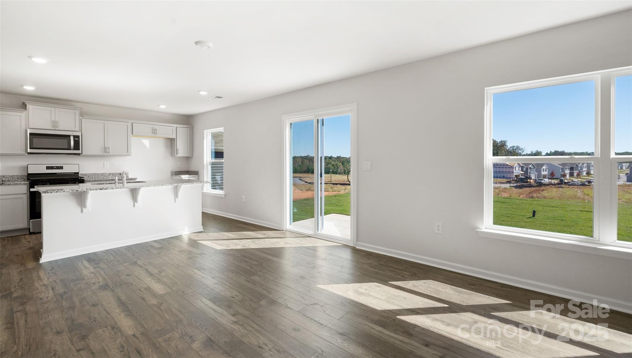 12 Byron Park Road Clyde, NC 28721 - Photo 10 of 20 a view of a kitchen with wooden floor and a window