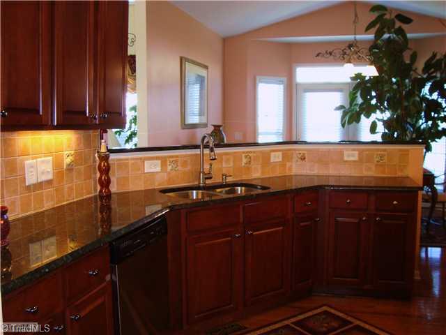 2119 Edgemont Road Greensboro, NC 27406 - Photo 11 of 16 Kitchen. Never far away from the action in this kitchen. From the sink area you have a full view of the Great Room and Breakfast area, This home has a very good flow for entertaining.